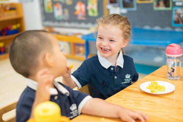 Two young students having lunch