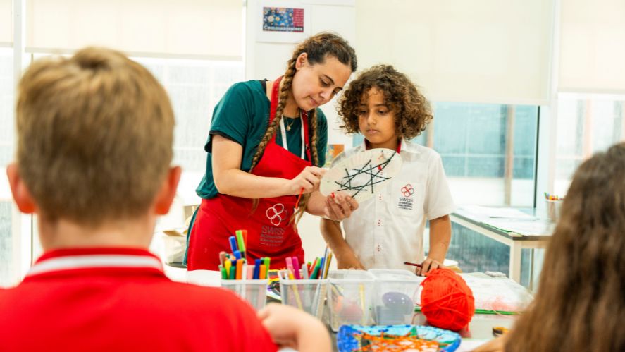 student with teacher in art