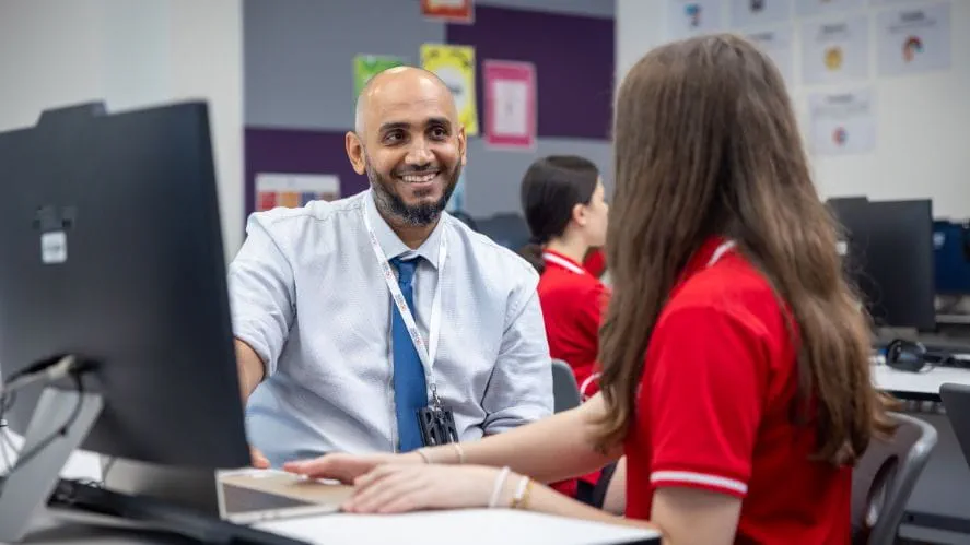 Teacher and student at a computer