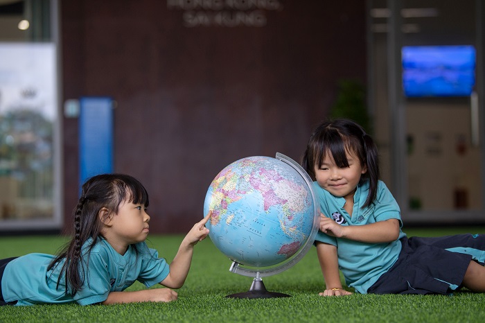 NAIS Hong Kong Primary School Students and world globe