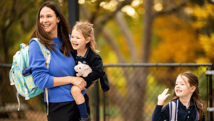 Parent holding BISB student
